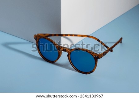 Sunglasses and glasses sale concept. Trendy sunglasses background. Trendy Fashion summer accessories. Copy space for text. Summer sale. Optic store discount poster. glasses with rounded frames. Royalty-Free Stock Photo #2341133967