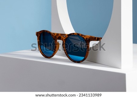 Sunglasses and glasses sale concept. Trendy sunglasses background. Trendy Fashion summer accessories. Copy space for text. Summer sale. Optic store discount poster. glasses with rounded frames. Royalty-Free Stock Photo #2341133989