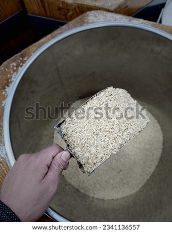 Dry white long rice basmati in scope for sale in the supermarket. 