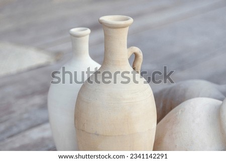 Two clay jars at the traditional market in old Dubai, UAE. High quality photo.