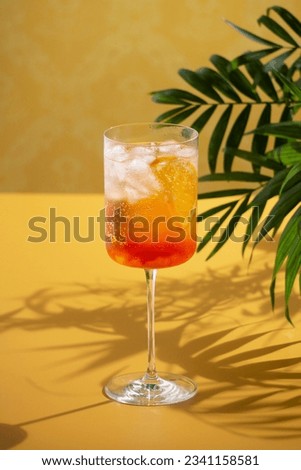 Red cocktail in base of Campari or bitter with oranges. Italian cocktail. Delicious cocktail drink background. mixed drinks, tropical drink. Aperitif with Americano cocktail. Light Summer Cocktails.