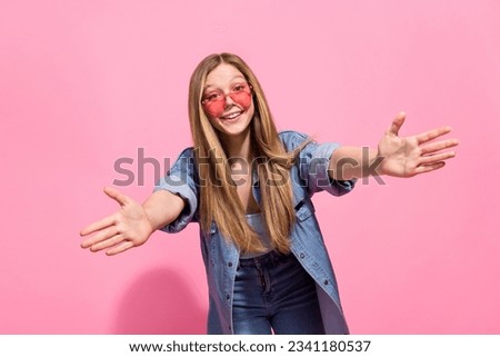Photo portrait of lovely teen young lady stretching hands want hug embrace dressed stylish denim garment isolated on pink color background