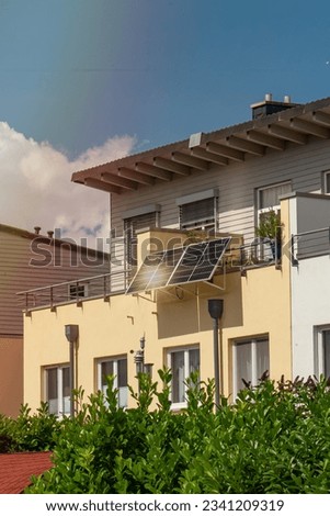 Solar power plant on a balcony with sunlight reflection and special lens flare light effect. Balcony solar power station eco-friendly to use renewable energy. 