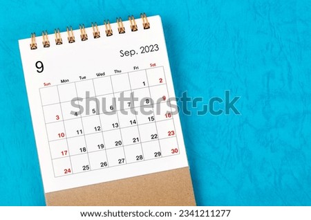 September 2023 Monthly desk calendar for 2023 year on blue background. Royalty-Free Stock Photo #2341211277