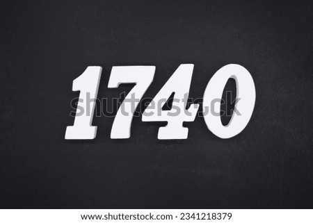 Black for the background. The number 1740 is made of white painted wood.