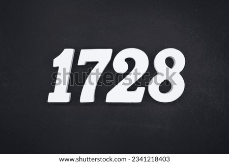 Black for the background. The number 1728 is made of white painted wood.