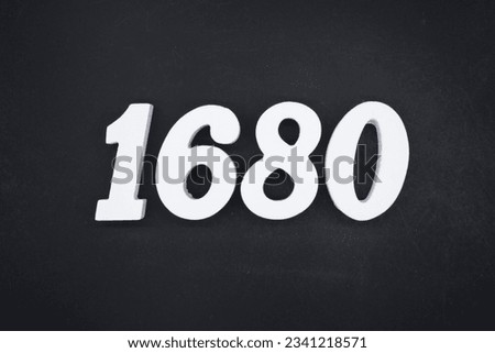 Black for the background. The number 1680 is made of white painted wood.