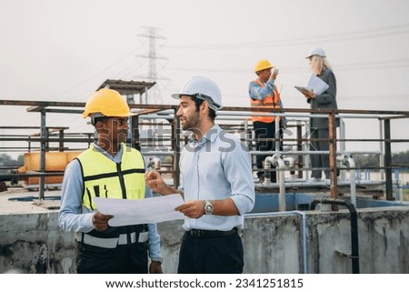 Professional Technician Ensuring Pollution Control in Wastewater Treatment Plant. Worker checking the waste water treatment pond industry. Royalty-Free Stock Photo #2341251815