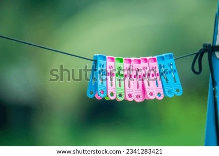 The device for holding clothes that have been washed and dried in the sun is made of plastic.