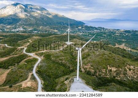 Wind turbines in hill landscpae in wind park. Close-up shot