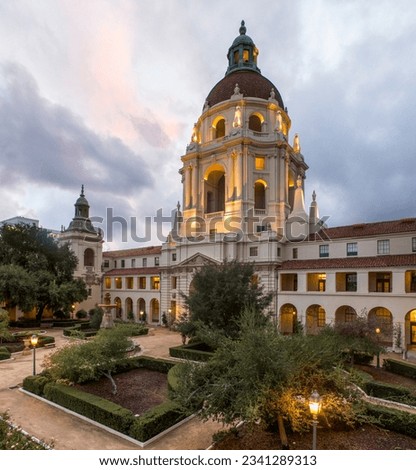 An architecture view of the Pasadena City Hall building in California at sunset with clouds