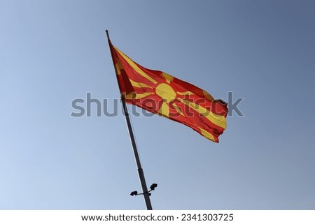 The flag of North Macedonia on sky