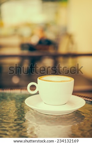 latte coffee in white cup - vintage effect style pictures