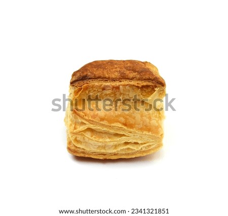 A closeup image of puff pastry in the incision with blown large crunchy layers of golden brown crust Royalty-Free Stock Photo #2341321851