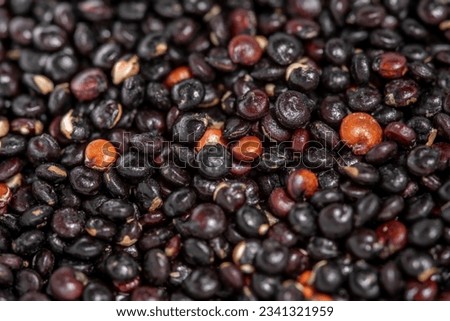 Seeds black quinoa, close-up. Top view and selective focus. Healthy diet
