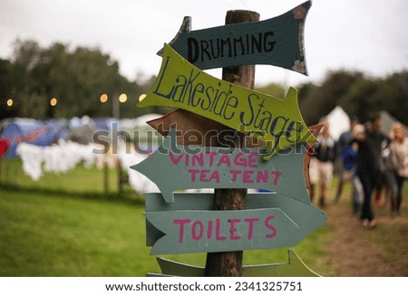 Wooden signs at a festival campsite