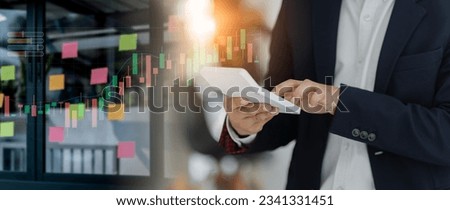 Asian businessman holding a calculator, business finance concept. 