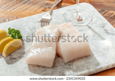 Chilean Sea Bass Fillet on Marble Cutting Board, Sea Bass fillet, Fresh, Raw Seafood Fillet Royalty-Free Stock Photo #2341349035