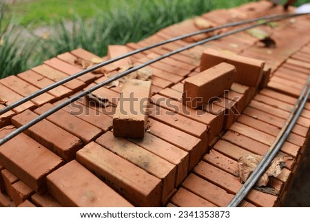 Pallet a red brick building material stack of new red bricks for construction
