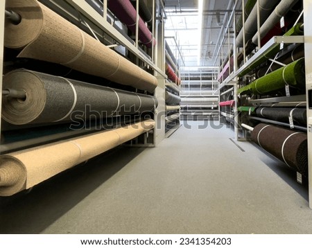 Carpet store. Carpets rolled up. Large assortment of carpets. Royalty-Free Stock Photo #2341354203