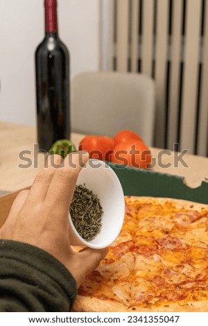finishing preparing a pizza with oregano, delicious fast food, restaurant lifestyle, wallpaper