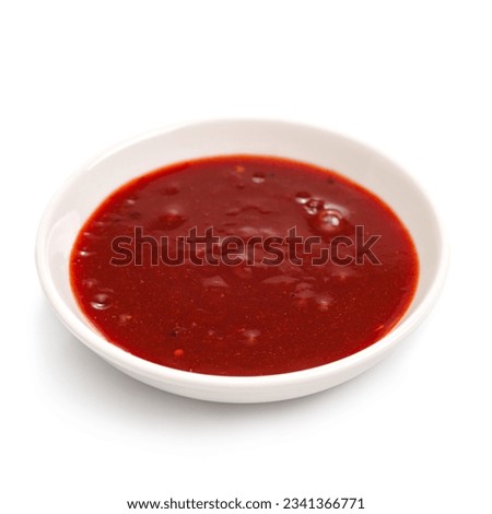 Kimchi sauce in a bowl on a white background. For the restaurant menu.