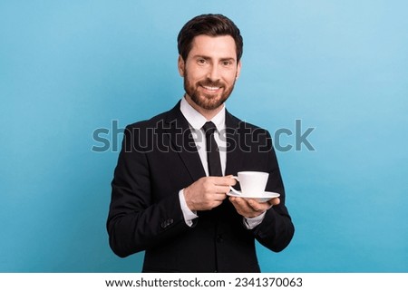 Photo of cool handsome boss guy dressed black suit having break drinking tea isolated blue color background