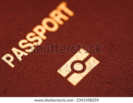 a close up view of Passport with e-passport symbol in red background