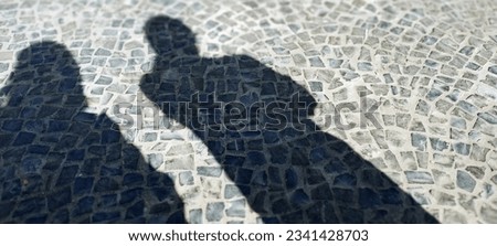 shadow of people on stone floor 