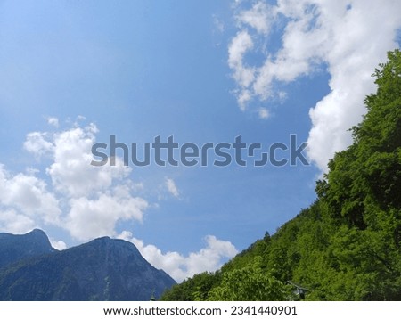Mountain and blue sky clouds in Hallstatt village, Austria.