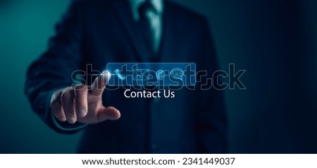 Contact us or Customer support hotline, people connect. Businessman touching on virtual screen contact icons (email, address, live chat, telephone). Customer service, helpdesk advice online support Royalty-Free Stock Photo #2341449037