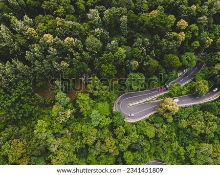 drone shot aerial view top angle beautiful dangerous mountain rocks afforestation sustainable dense forest natural scenery wallpaper background yercaud tamilnadu india tourist destination lust woods  Royalty-Free Stock Photo #2341451809