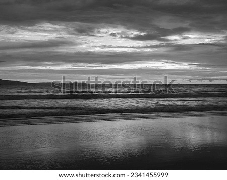 Black and white photo of a beautiful sunset at the beach