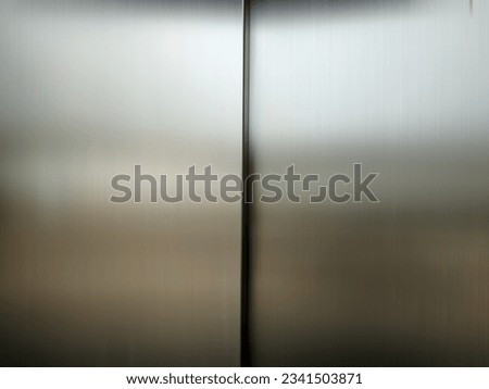 light on stainless steel penel. Royalty-Free Stock Photo #2341503871
