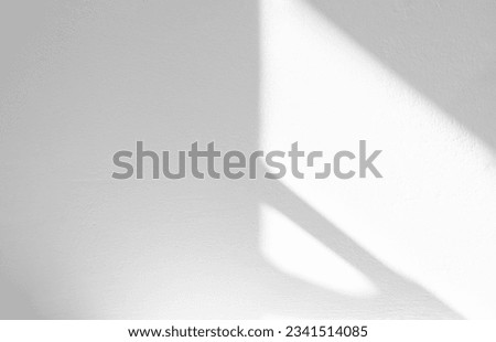 White wall concrete texture with abstract drop diagonal shadow. Sunlight overlay on white plaster paint on concrete floor,Light effect for Monochrome photo,mock up,poster, wall art,design presentation