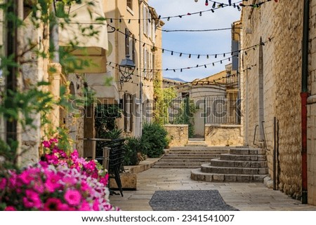 Traditional old stone houses on a street in the medieval town of Saint Paul de Vence, French Riviera, South of France Royalty-Free Stock Photo #2341541007