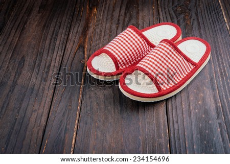 Slipper on wooden background - vintage effect style pictures