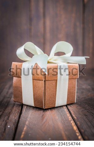 Gift box on wooden background - vintage old effect style pictures