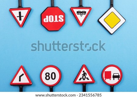 driver's license exam preparation, road safety and security, road signs on a blue background, copy space