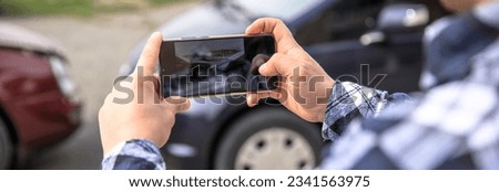 Man hand phone car accident in street

