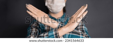 woman face medical mask and hand stop sign
