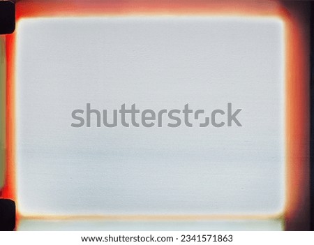 real scan of empty or overexposed 8mm film, cool film photoplaceholder frame with light leaks. Royalty-Free Stock Photo #2341571863
