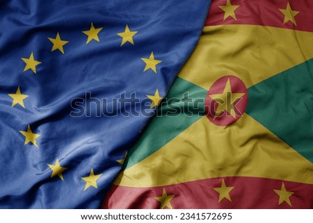 big waving realistic national colorful flag of european union and national flag of grenada . macro