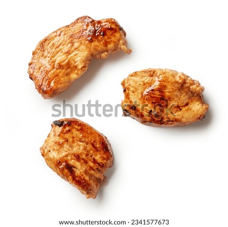 pieces of juicy fried chicken breast fillet meat isolated on white background, top view Royalty-Free Stock Photo #2341577673