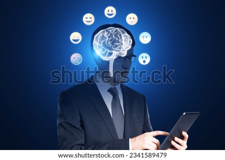 Emotional intelligence concept. Polygonal human brain and various human emotions: fear, surprise, joy, sadness, anger. Brain head businessman using cellphone with hologram on blurry background