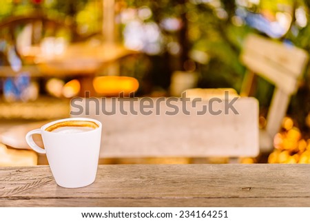 Latte coffee cup in white mug on wooden table - vintage effect style pictures