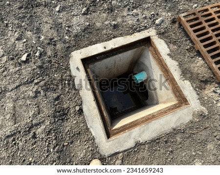 A sewerage system, or wastewater collection system, is a network of pipes, pumping stations, and appurtenances that convey sewage from its points of origin to a point of treatment and disposal. Royalty-Free Stock Photo #2341659243