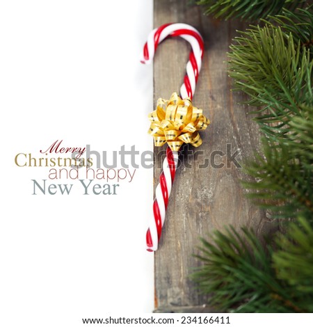 Christmas Candy Cane and decorations over white