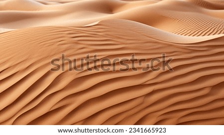 The setting sun casts a brilliant glow over the expansive rippled Saudi Arabian desert, illuminating the sandy peaked dunes. Royalty-Free Stock Photo #2341665923