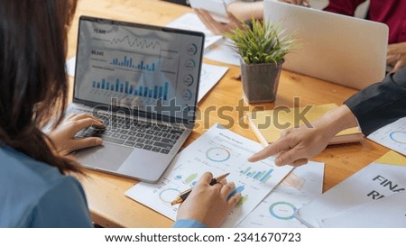 accountant with laptop and paperwork analyzing financial data report Royalty-Free Stock Photo #2341670723
